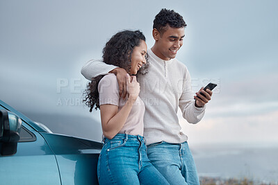 Buy stock photo Couple, phone and texting on road trip, holiday and search for direction on digital map with car by ocean. Man, woman and happy with chat on smartphone, scroll and hug on vacation with travel app