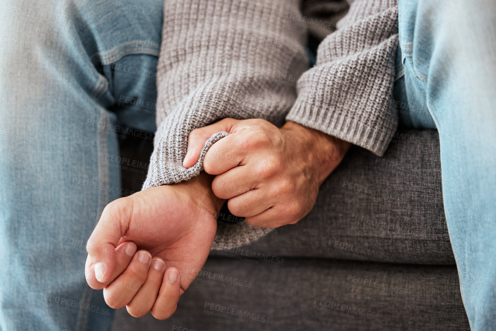 Buy stock photo Hands, anxiety and closeup of a man with depression, mental health problem and stress in home lounge. Male person on a couch for psychology, fear and life crisis on a sofa while sad or depressed