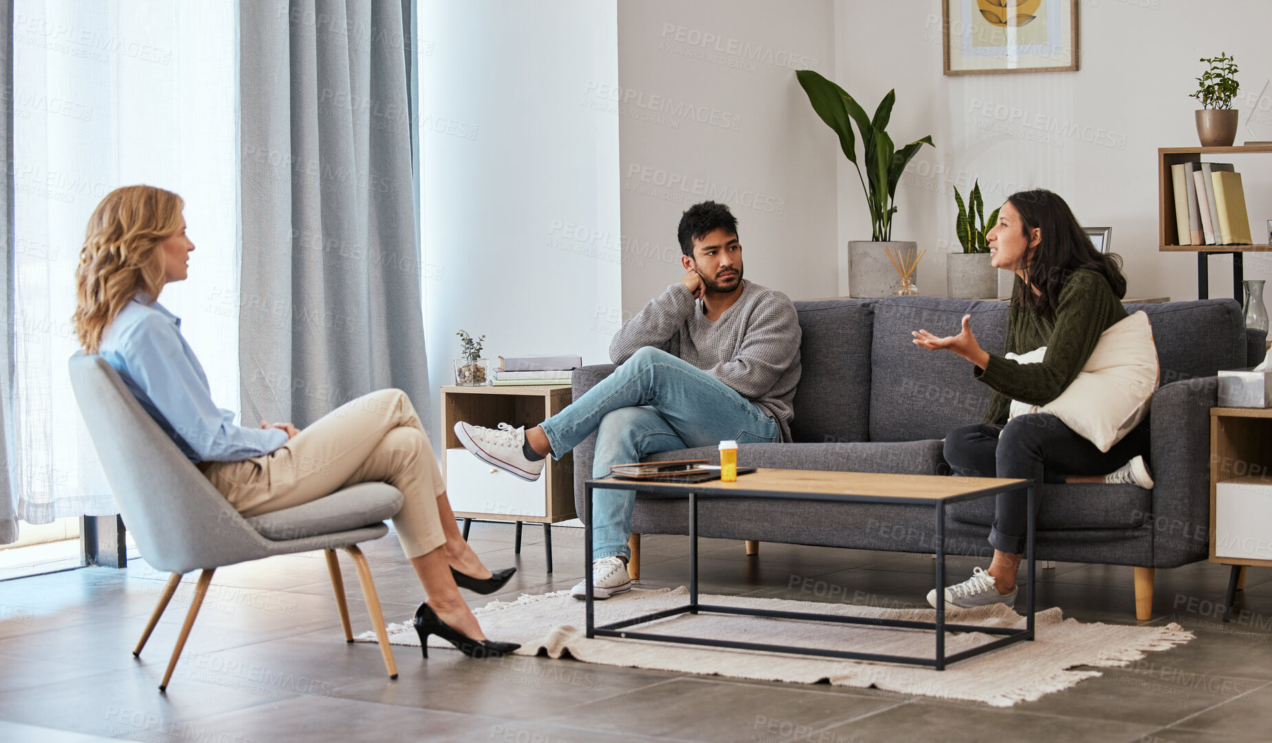 Buy stock photo Shot of a couple having an argument during a counseling session with a therapist