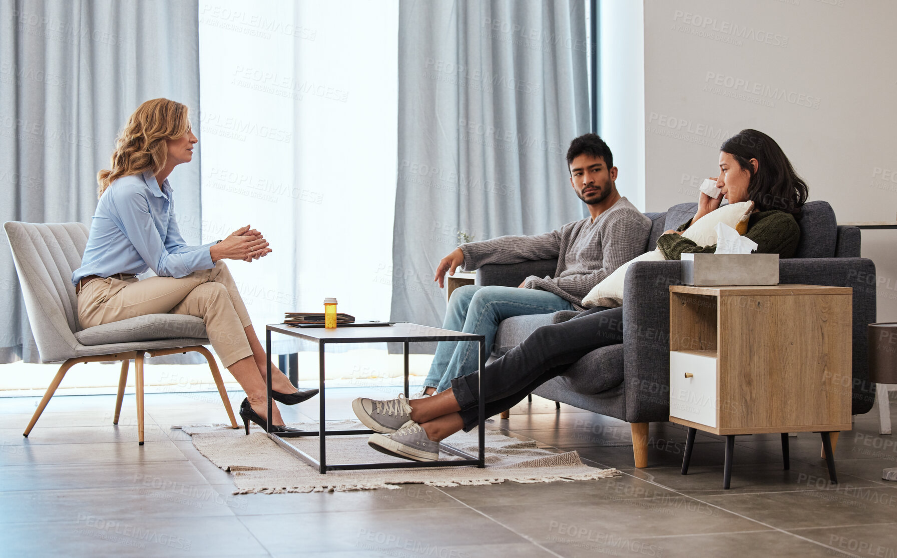 Buy stock photo Shot of a couple having an argument during a counseling session with a therapist