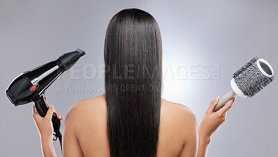 Buy stock photo Girl, brush and hairdryer in studio for hair care or styling, grooming and beauty routine for wellness or keratin treatment. Woman, tools and isolated on white background for healthy, shine and glow.