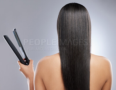 Buy stock photo Girl, back and flat iron in studio for hair grooming or styling, haircare and beauty routine for wellness or keratin treatment. Woman, tool and isolated on white background for result, shine and glow