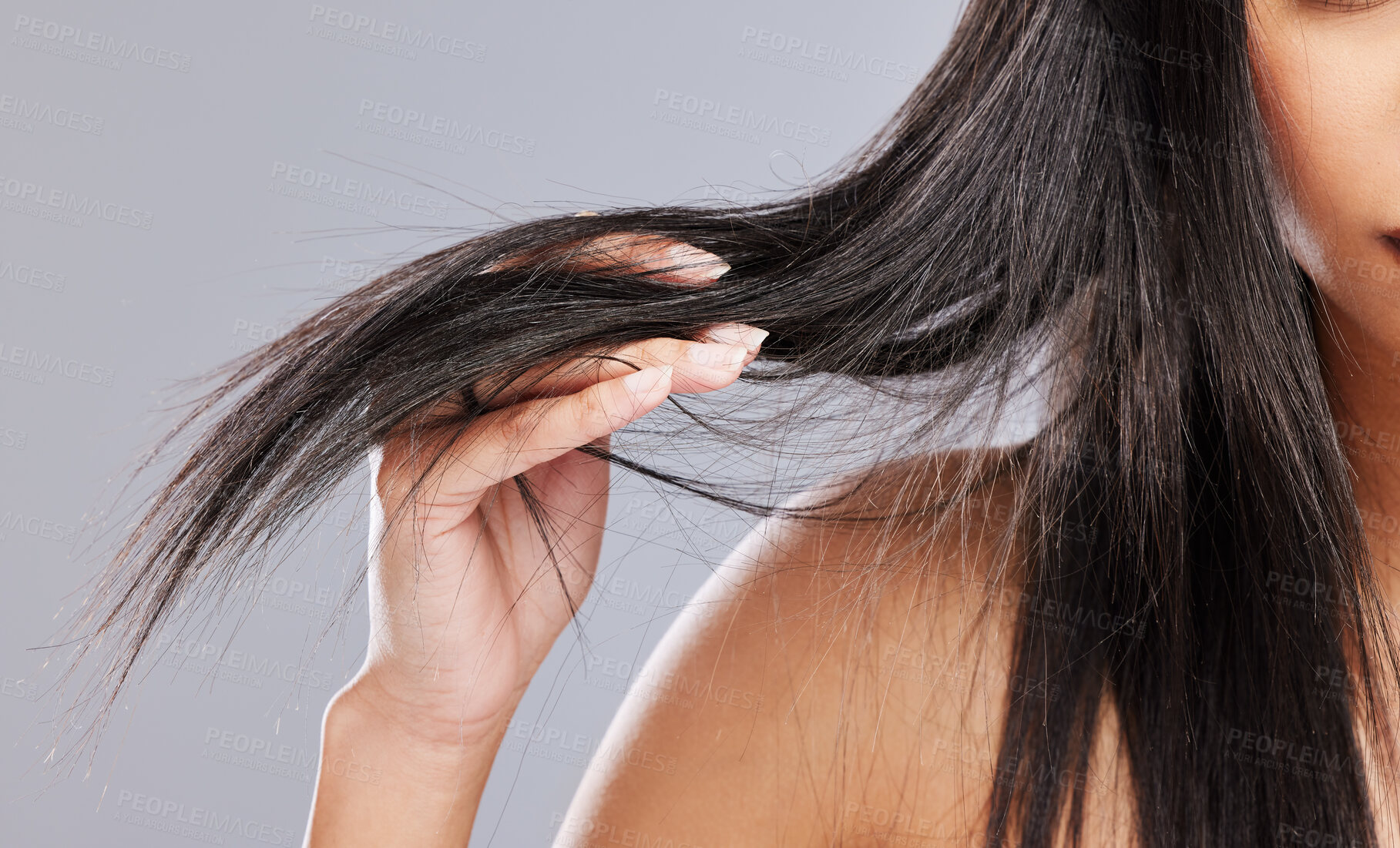 Buy stock photo Hair in hands, damage and woman in studio with worry for split ends, haircare crisis and weak strand. Beauty, hairdresser and closeup of upset female person with frizz problem on gray background