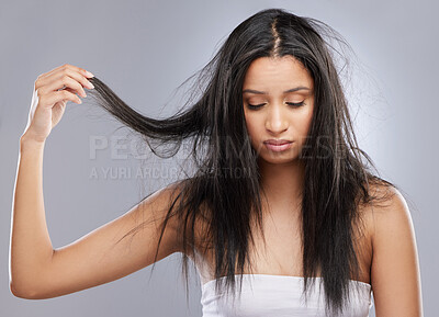 Buy stock photo Hair care, damage and face of woman in studio with worry for split end, haircare crisis and weak strand. Beauty, hairdresser and upset female person with frizz, dry or loss problem on gray background