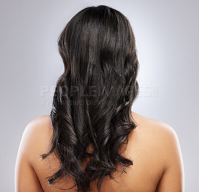 Buy stock photo Hair care, health and back of woman in studio with natural, beauty and salon treatment for wellness. Cosmetics, grooming and female person with long, curly and shiny hairstyle by gray background.