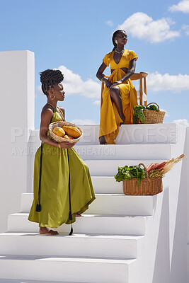 Buy stock photo Shot of two beautiful women posing on a staircase  outside