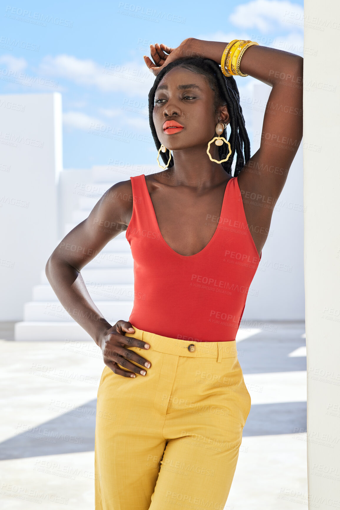 Buy stock photo Cropped shot of an attractive young woman posing on a rooftop outdoors