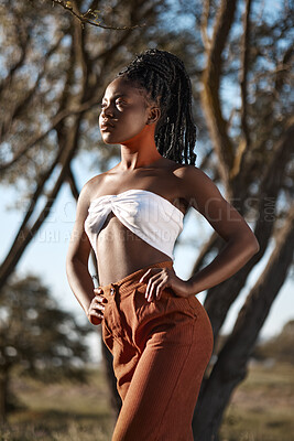 Buy stock photo Shot of a beautiful young traditional woman posing outside