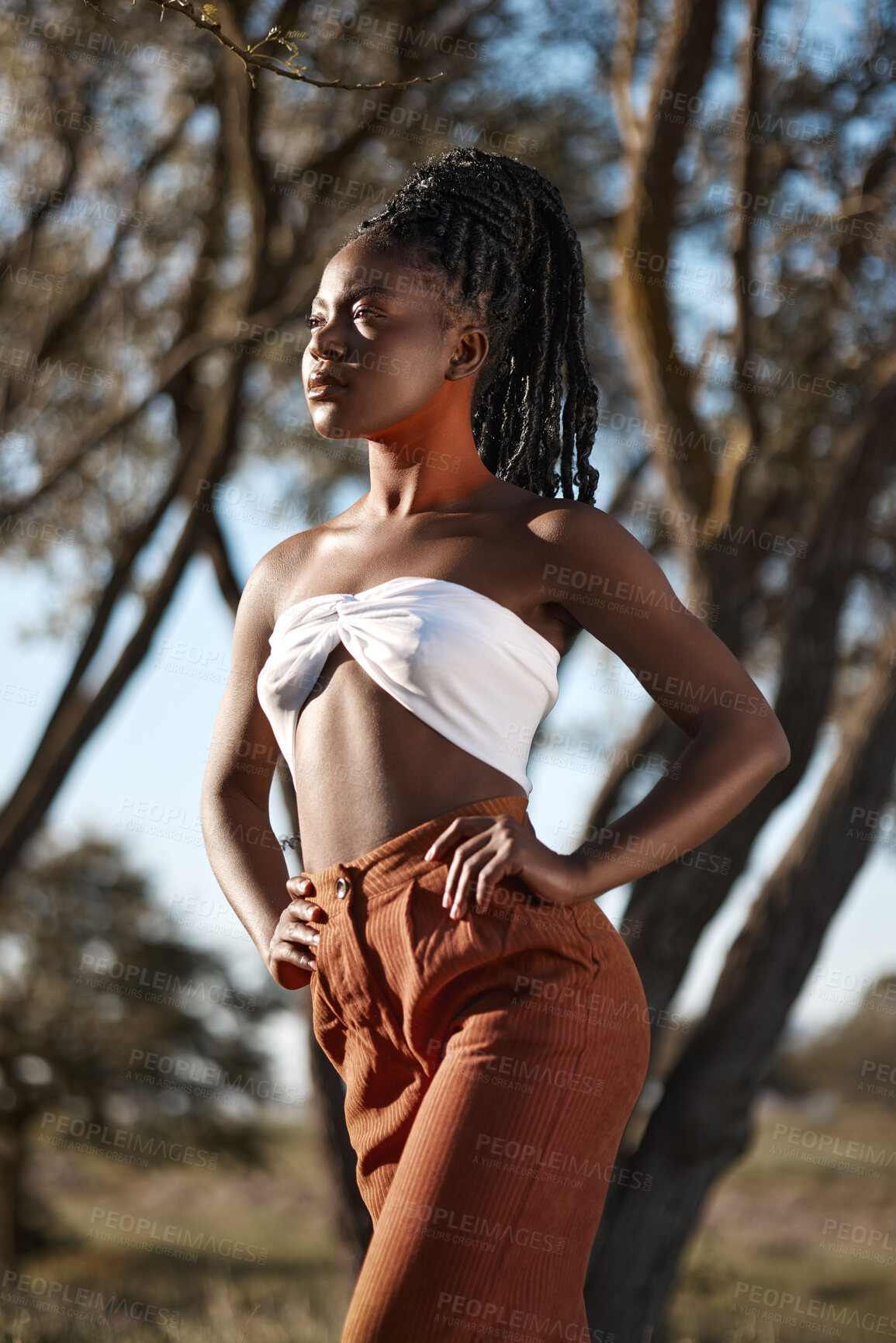 Buy stock photo Shot of a beautiful young traditional woman posing outside