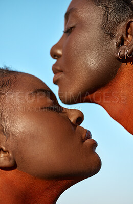 Buy stock photo Shot of two beautiful tribal women posing outside together