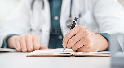 Buy stock photo Closeup shot of an unrecognisable doctor writing notes in a medical office
