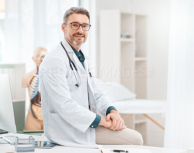 Buy stock photo Portrait of a mature doctor working in a medical office