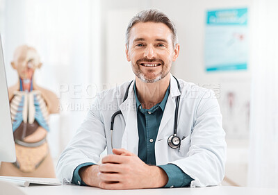 Buy stock photo Portrait of a mature doctor working in a medical office