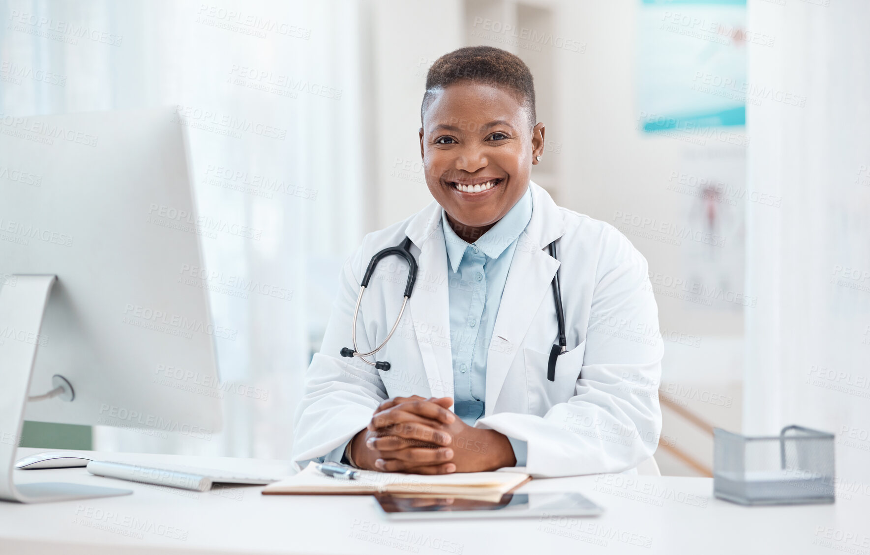 Buy stock photo Portrait of a young doctor working in a medical office