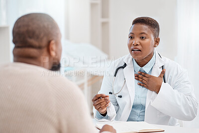 Buy stock photo Shot of a young doctor having a consultation with a patient in a medical office