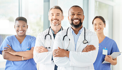 Buy stock photo Shot of a group of medical practitioners standing together in a hospital