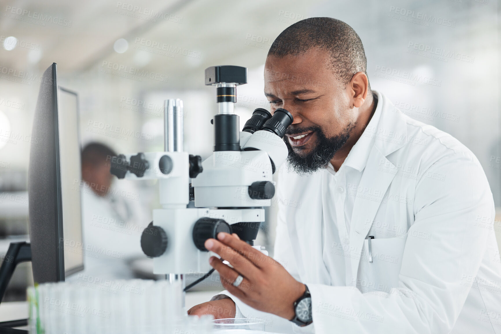 Buy stock photo Black man, microscope and smile for scientist in lab with sample or medical research for pharmacy. Biotech, science experiment and mature person for analysis, test and drug invention or development