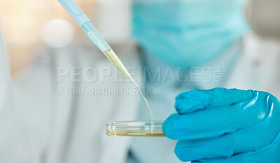Buy stock photo Cropped shot of an unrecognisable scientist holding a petri dish and using a dropper in her laboratory