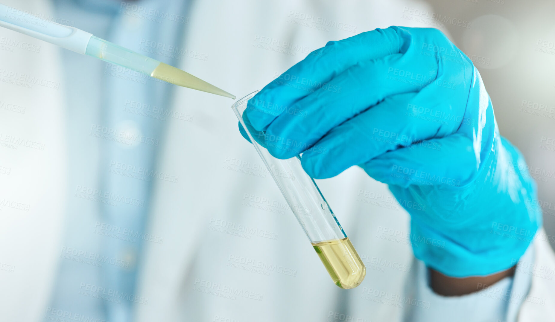 Buy stock photo Cropped shot of an unrecognisable scientist using a test tube and dropper in the laboratory