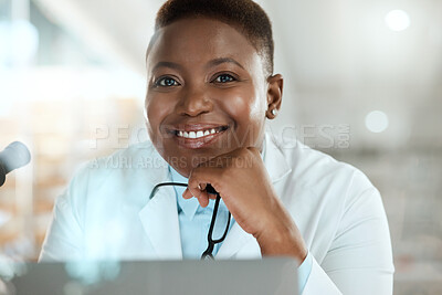 Buy stock photo Shot of an attractive young scientist sitting alone in her laboratory
