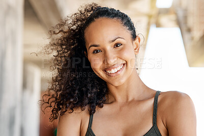 Buy stock photo Shot of an attractive young woman standing alone in the city during her outdoor workout