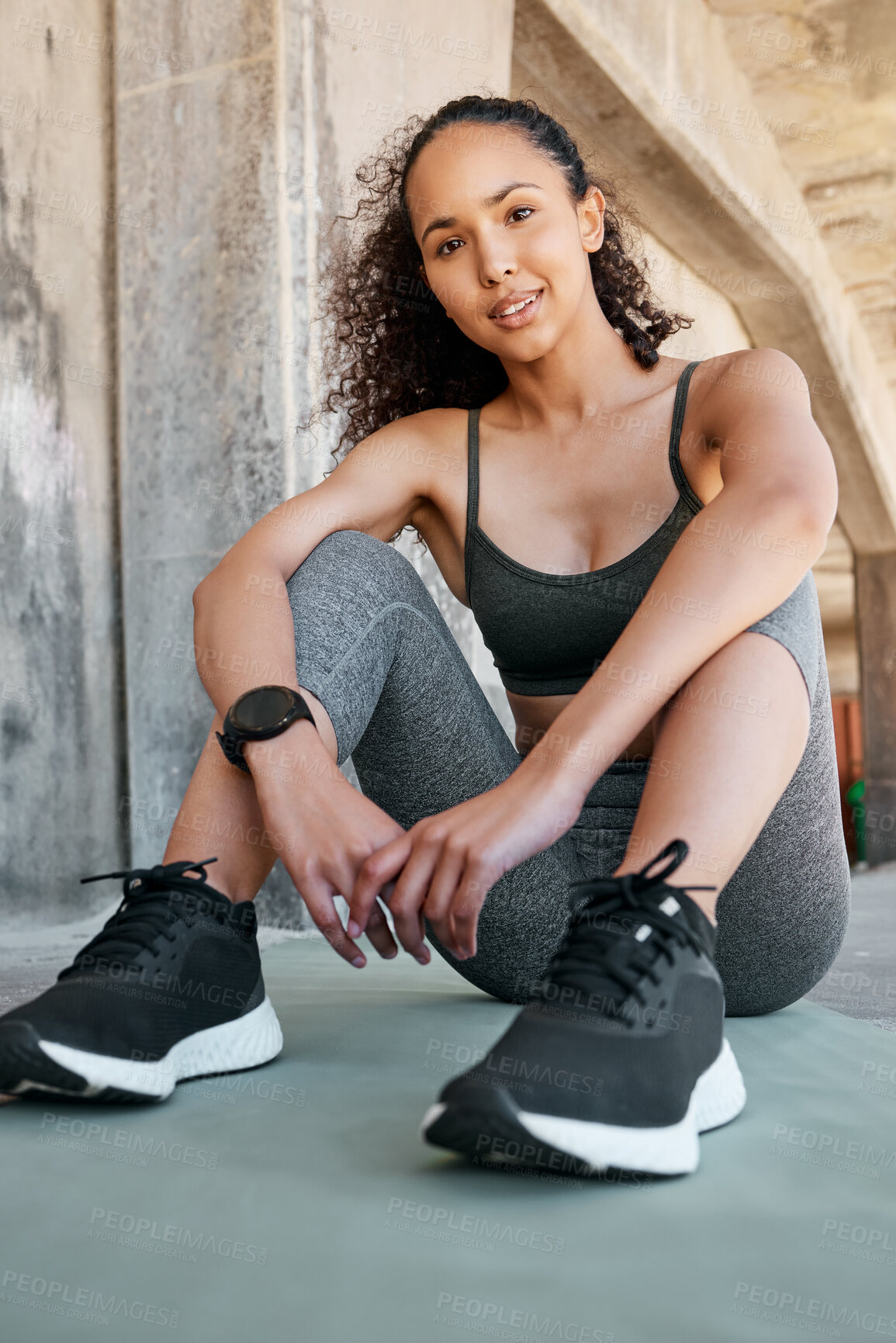 Buy stock photo Full length shot of an attractive young woman sitting alone during her outdoor workout