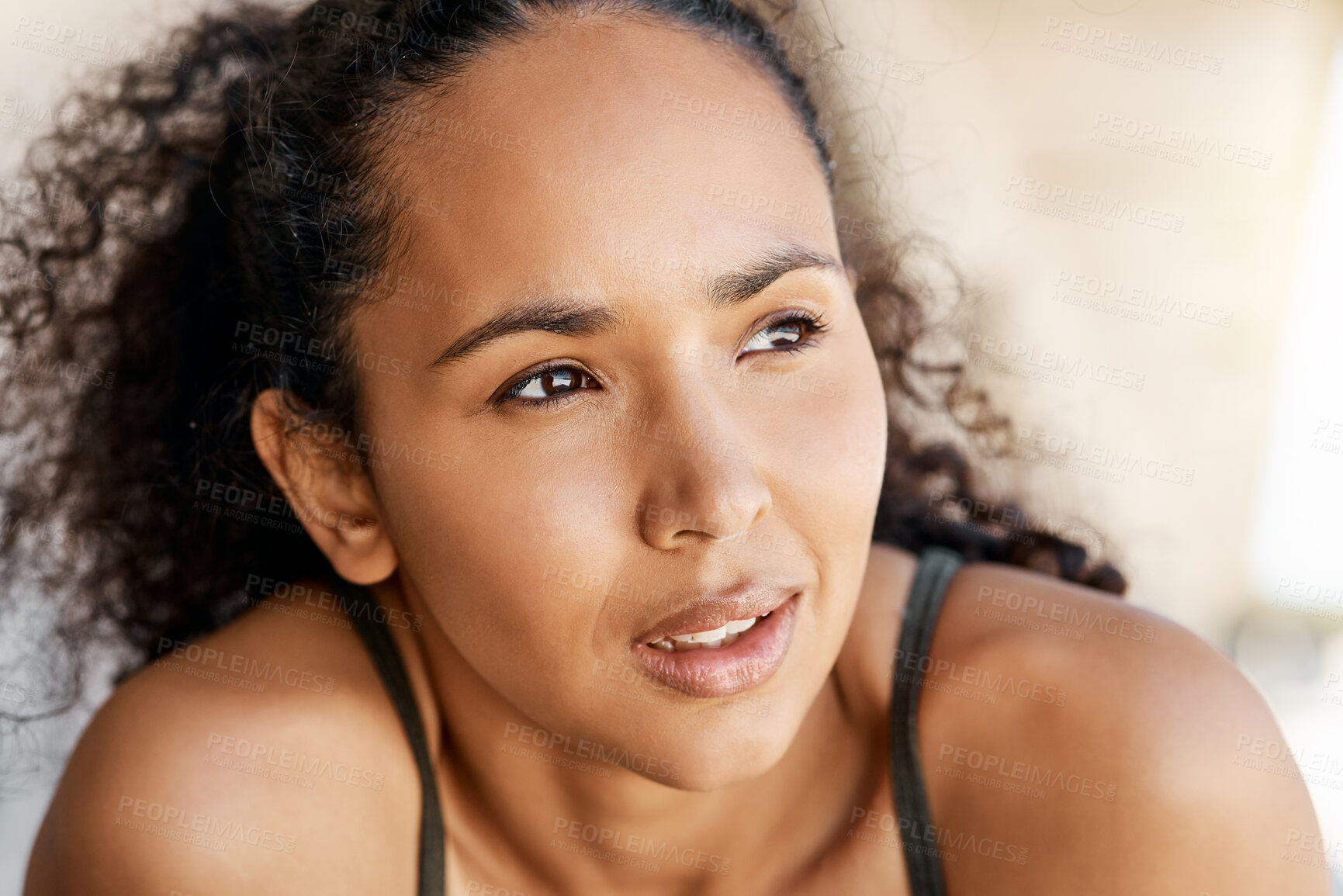 Buy stock photo Shot of an attractive young woman taking a moment to catch her breath during her outdoor workout