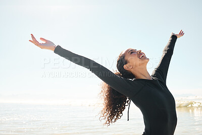 Buy stock photo Shot of a young woman celebrating on the beach