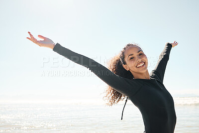 Buy stock photo Shot of a young woman celebrating on the beach