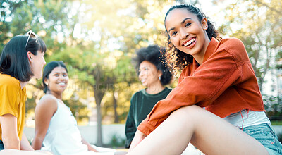 Buy stock photo Shot of a female hanging out with her friends in a park