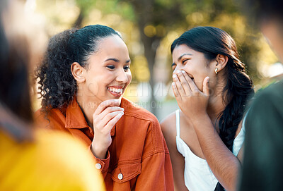 Buy stock photo Shot of two friends laughing in a park