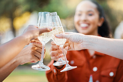 Buy stock photo Shot of friends toasting in a park