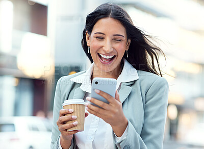 Buy stock photo Shot of a young businesswoman having coffee and using a smartphone against an urban background