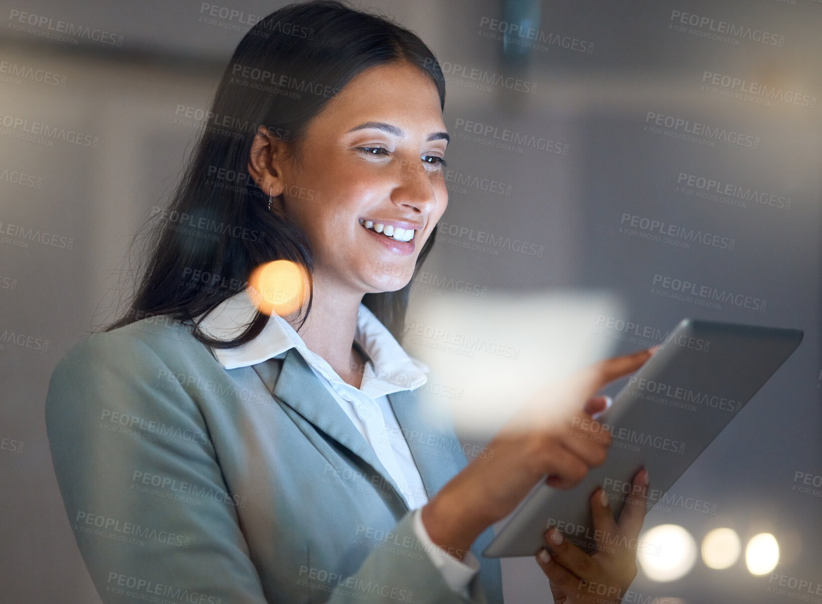 Buy stock photo Cropped shot of an attractive young businesswoman working late at her company offices