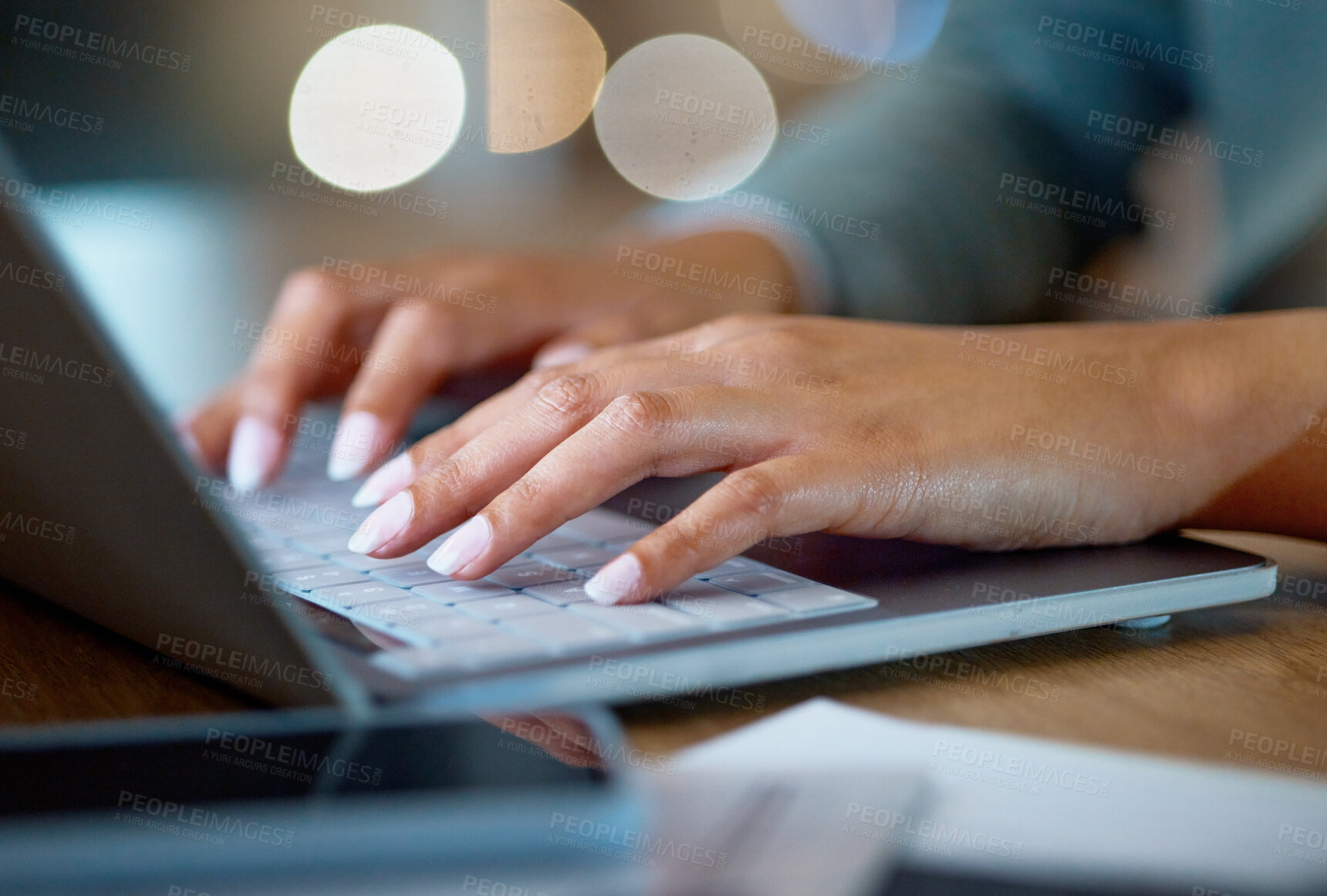 Buy stock photo Cropped shot of an unrecognizable businesswoman working late at her company offices