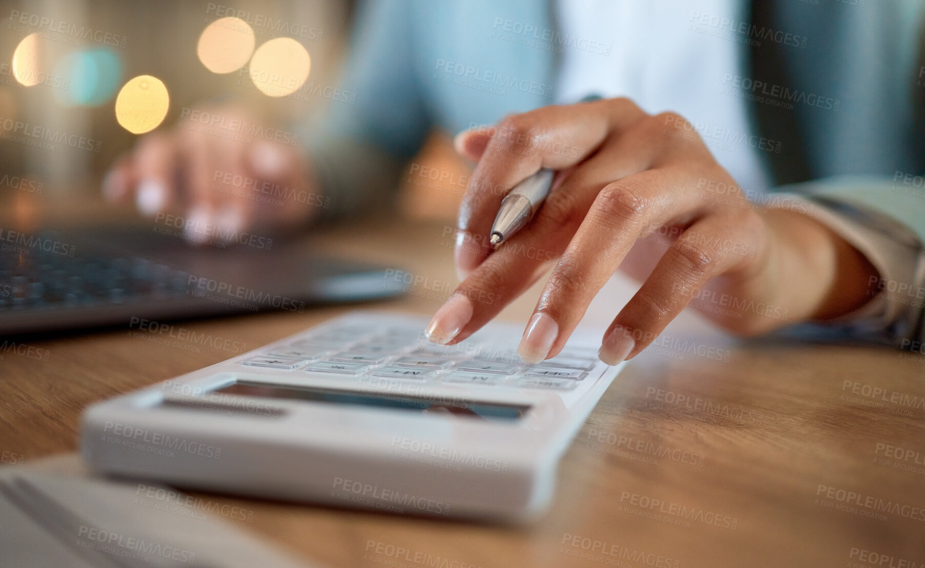 Buy stock photo Cropped shot of an unrecognizable businesswoman working late at her company offices