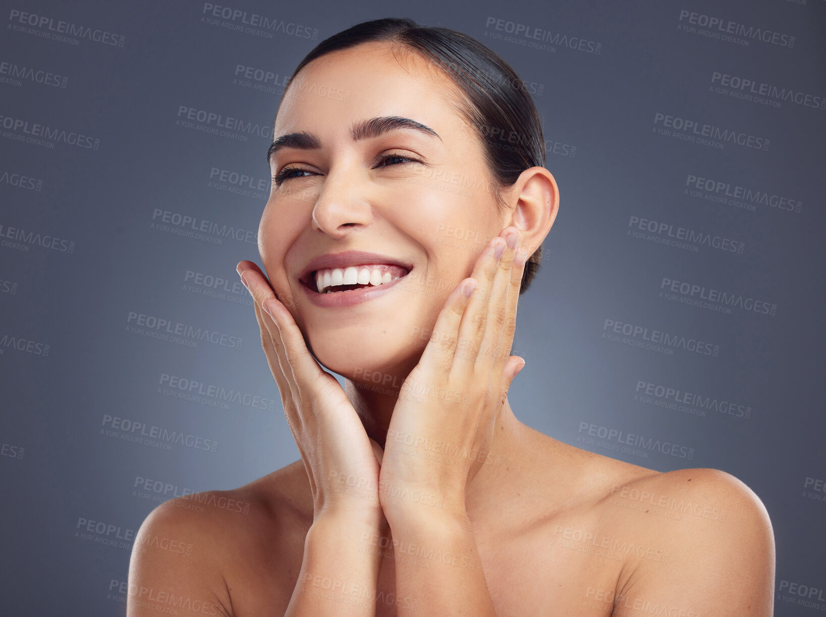 Buy stock photo Studio shot of a beautiful young woman posing against a grey background