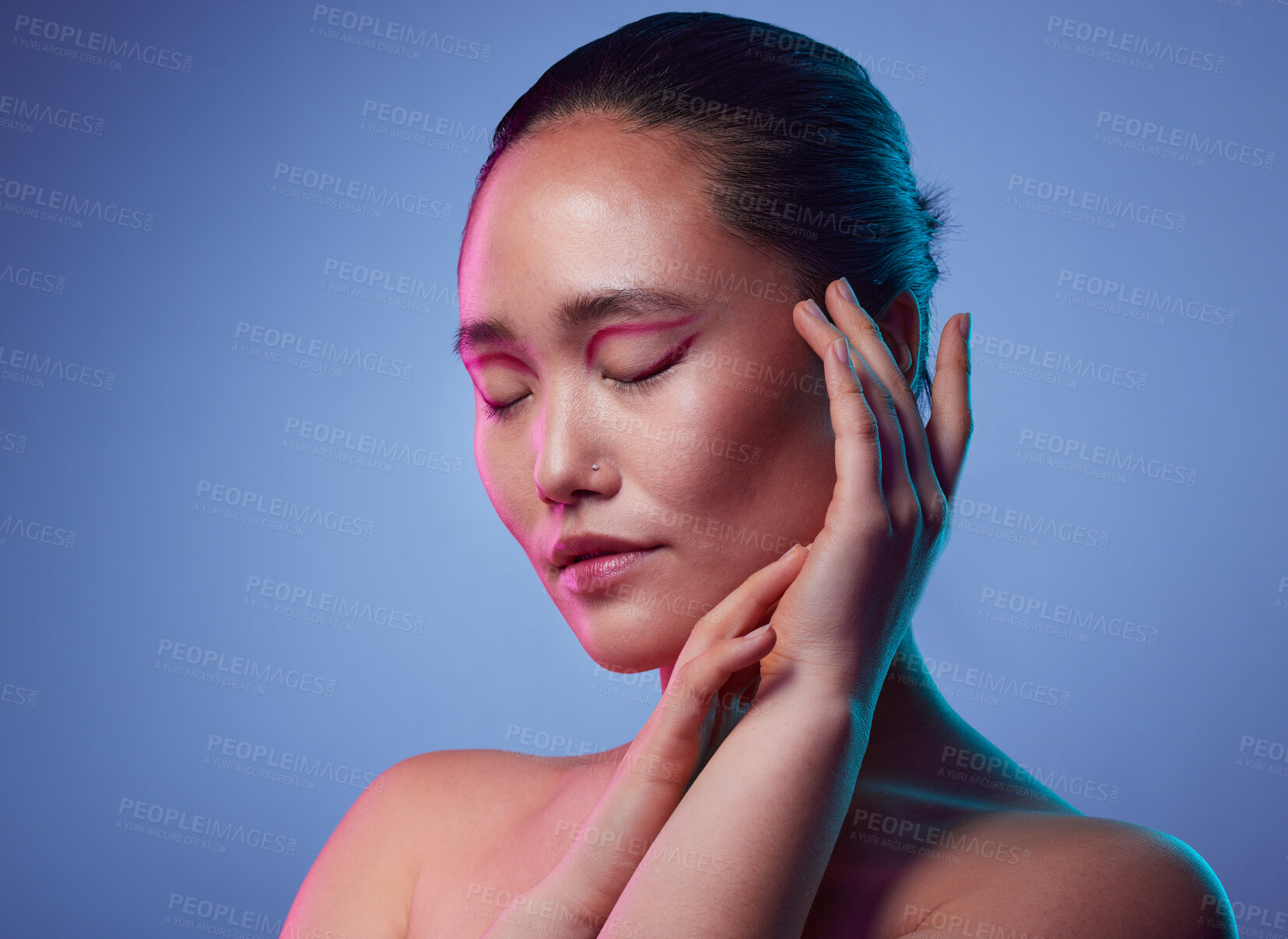 Buy stock photo Makeup, beauty and touch with asian woman in studio for graphic eyeliner, cosmetics or self care. Glow, foundation and cosmetology with female person on background for eyeshadow, crease cut and shine