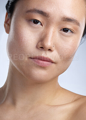 Buy stock photo Shot of a young woman standing against a grey background