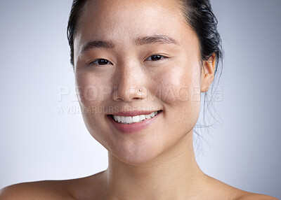 Buy stock photo Shot of a young woman standing against a grey background