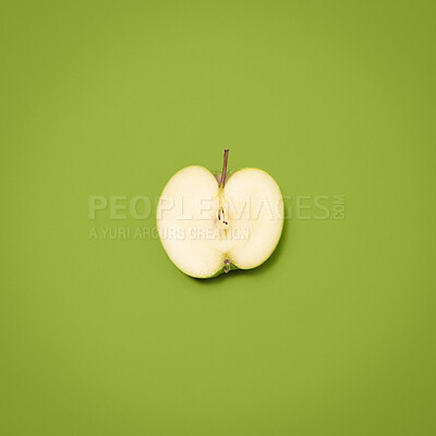 Buy stock photo Apple, stem and nutrition and by green background for wellness, vitamin c and minerals by mockup space. Organic fruit, vegan breakfast and healthy snack by backdrop for fiber, aid digestion or studio