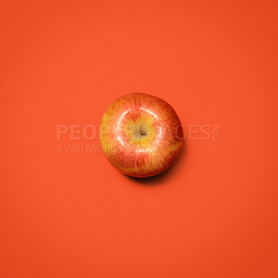 Buy stock photo Above, apple and fresh in studio for nutrition, healthy eating and gut health. Fruit, produce or snack on red background for fiber, digestion aid or antioxidants in diet with sweet food with juice