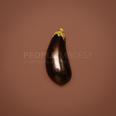 Buy stock photo Eggplant, fruit and studio background as ingredient for cooking, nutrition and diet. Food, organic and natural with healthy meal for wellness, health and self care with vitamins on wellbeing