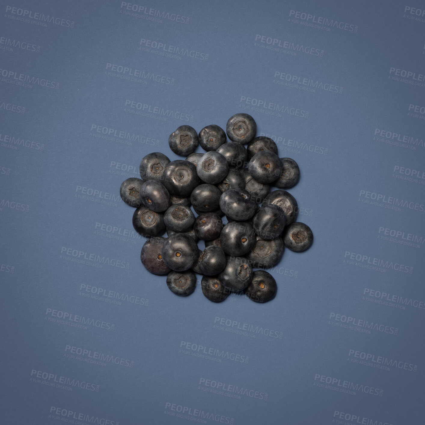 Buy stock photo Blueberry, pile and fruit in studio for diet or wellness, sustainability and organic snack for nutrition. Billberry, isolated and blue background for vitality or digestion, vitamins and fiber.