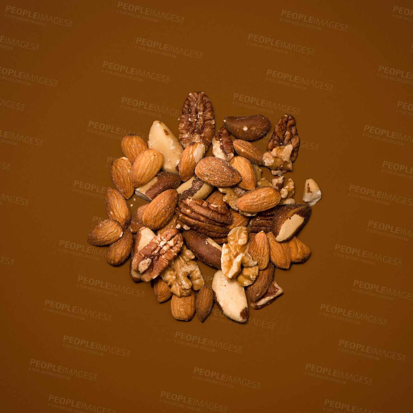 Buy stock photo Food, nuts and nutrition in studio on brown background for snack, lunch and diet for health.  Organic, natural and vegan for healthy cooking for wellness, wellbeing and self care with vitamins