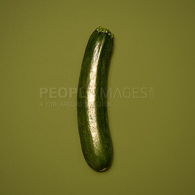 Buy stock photo Shot of a green marrow against a studio background