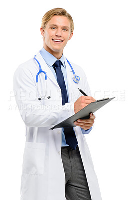 Buy stock photo Shot of a handsome young doctor standing alone in the studio and writing on a clipboard