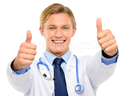 Buy stock photo Shot of a handsome young doctor standing alone in the studio and showing a thumbs up