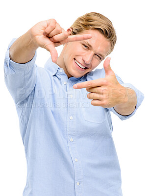 Buy stock photo Happy man, portrait and hands with frame for picture, moment or photography on a white studio background. Face of young male person or photogenic model with smile for composition, selfie or capture