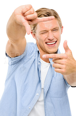 Buy stock photo Happy man, portrait and hands with frame for selfie, moment or photography on a white studio background. Face of young male person or photogenic model with smile for composition, picture or capture